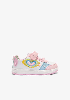 Pastel-colored children's sneaker with heart design on a white background
